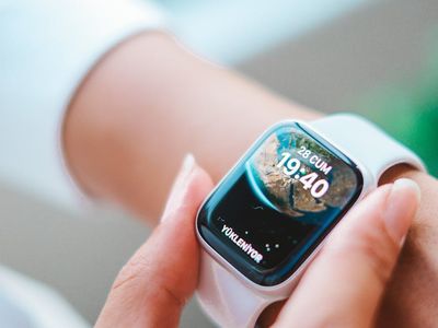 Close up of a person adjusting their fitness watch.